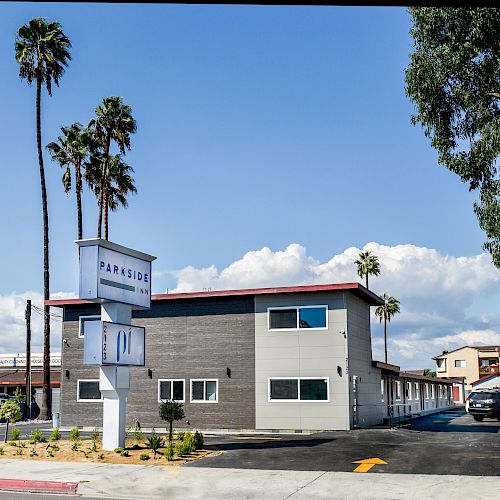 A modern two-story building with a sign that reads 