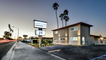 Image of a modern building at sunset with a 